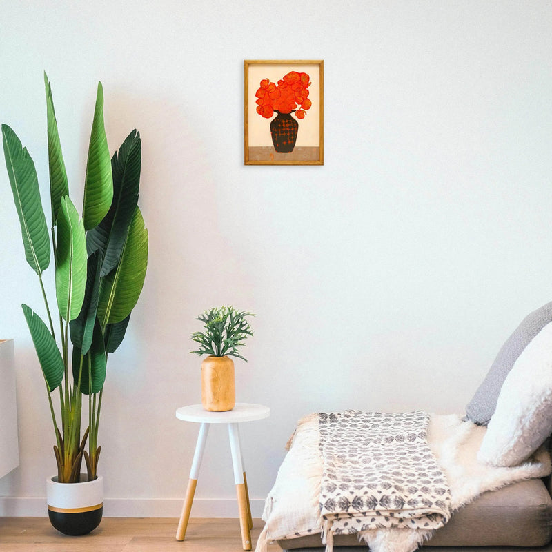 Orange bouquet and black vase