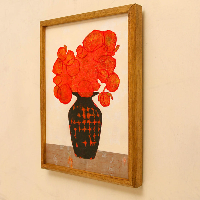 Orange bouquet and black vase